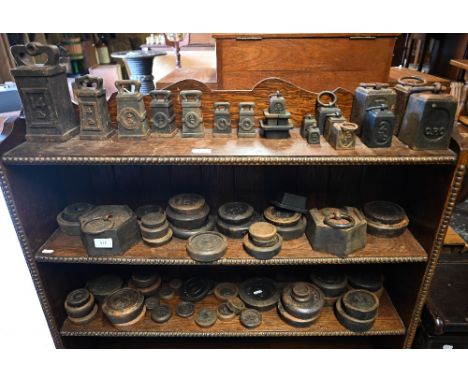 A large collection of vintage brass and iron trade spring balance scales - mostly Salter's balance scales and various cast ir