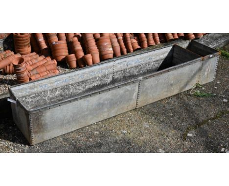 A large vintage galvanised cattle trough / planter, 242 x 48 x 40 cm h 