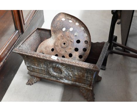 A weathered Regency style cast iron planter on flared feet, to/w a vintage tractor seat (2) 