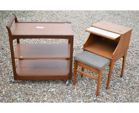 A mid-century teak three-tier drinks trolley to/w a 'Chippy' teak telephone table with integrated seat (foam removed) (2) 