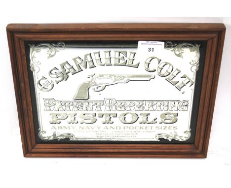 A vintage 'Samuel Colt patent repeating pistol' advertising wall mirror. Mounted in wooden frame, 31cm x 23.5cm 