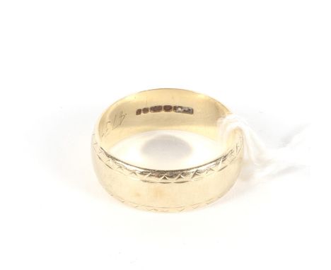 A 9ct gold wedding band. With geometric borders. Ring size N, weight 4g