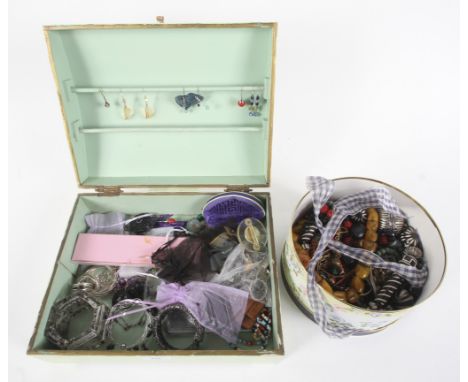 An assortment of jewellery. Including a silver and gem set ring, silver brooches, beaded necklaces, bangles, etc