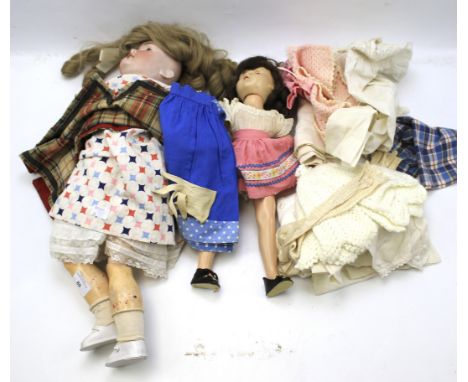 An F &amp; W Goebel doll and one other. The Goebel doll marked '124', with blue glass eyes, open mouth and blonde hair, L60cm