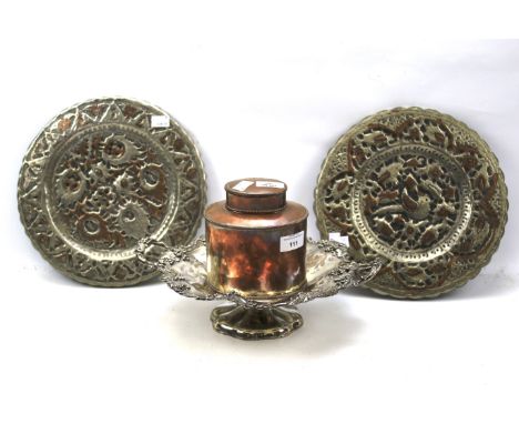 An assortment of metalware. Comprising a Georgian copper tea caddy, a silver plated double handled dish, and a pair of wall p