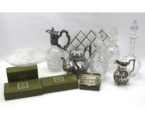 An assortment of glass decanters, silver plate and metalware. Including a teapot, cream jug, boxed Christorle knife rests, et