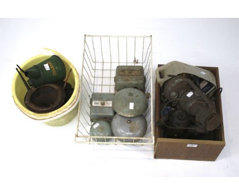 A collection of early 20th century and later oil cans. Including various bottle jacks, tools, a lantern, part sockets, etc