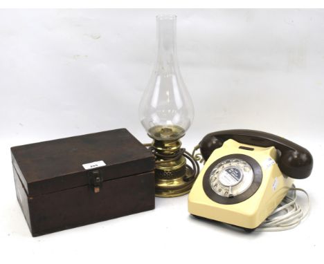 An assortment of collectables. To include a vintage post office telephone, brass table lamp with glass funnel and a mahogany 