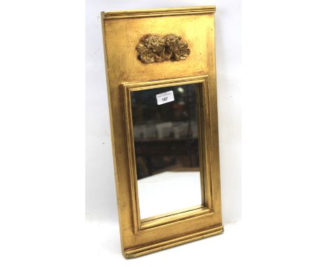 A early 20th century gilt wood and gesso wall mirror. Of rectangular form, the frame featuring a pair of cherubs, 24.5cm x 50