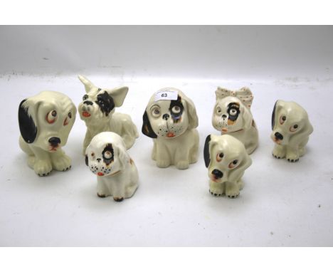 A collection of Crown Devon Bonzo ceramic figures of dogs. In various poses and of assorted sizes