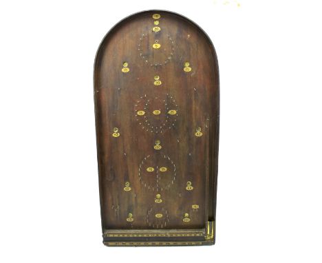 A vintage bagatelle game. The wooden structure printed with gilt numbers, L77cm