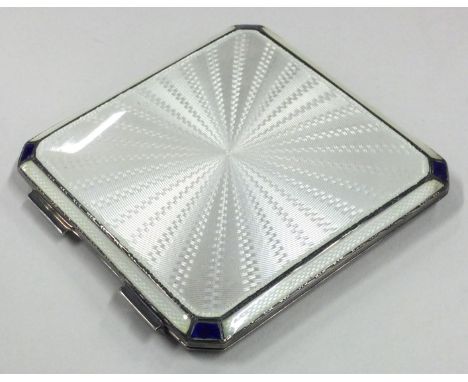 A silver and white enamelled compact with blue corners. Birmingham 1941. By Adie Brothers. Approx. 107 grams. Est. £150 - £20