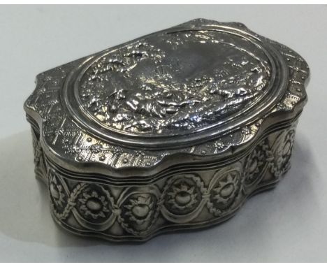 A late 19th Century silver snuff box with hinged lid embossed with scenes. Marked to side. Approx. 50 grams. Est. £80 - £120.