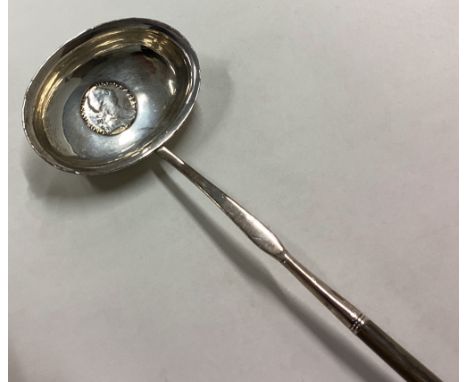 A Georgian silver toddy ladle with whalebone handle. Approx. 56 grams. Est. £30 - £50.