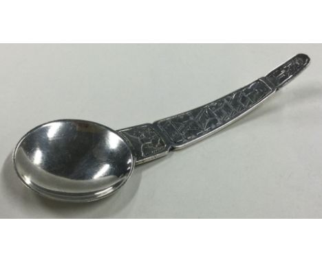 An Arts and Crafts Continental silver caddy spoon. Marked 830. Approx. 24 grams. Est. £30 - £40.