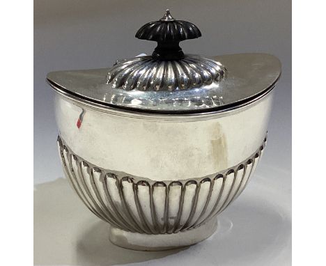 A silver tea caddy of fluted design with hinged lid. Sheffield 1906. By Martin Hall & Co. Approx. 172 grams. Est. £120 - £150