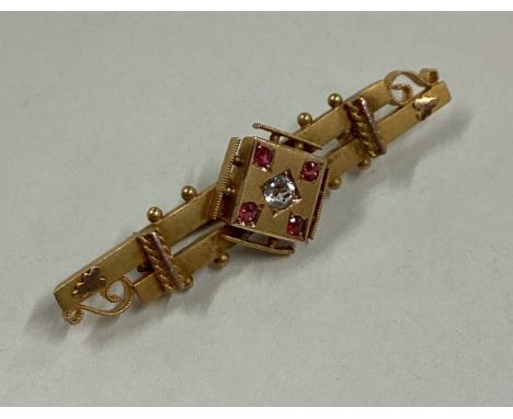 An attractive Victorian ruby and diamond brooch in 15 carat gold mount. Approx. 3 grams. Est. £50 - £80.