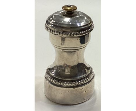 A French silver pepper grinder with beaded decoration. Circa 1900. Approx. 140 grams. Est. £30 - £40.
