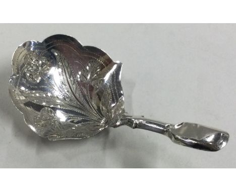 A Victorian silver caddy spoon with bright-cut decoration. Birmingham 1866. By Hilliard & Thomason. Approx. 6 grams. Est. £60