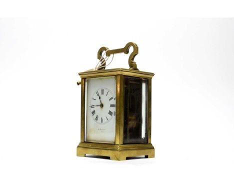 A 19th century French brass carriage clock, retailed by A. Pattorini, Paris, with white enamel Roman dial, platform lever esc