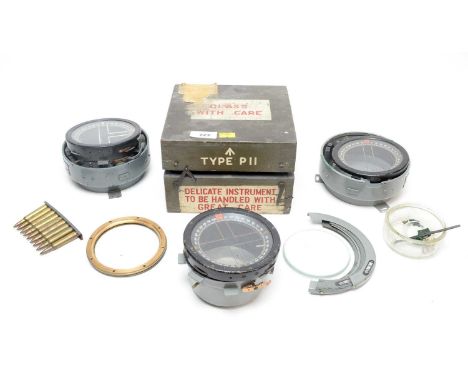 A British Type P11 compass, in case; together with another partial Type P11 compass; a selection of compass parts, and other 