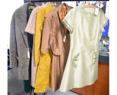 A collection of vintage dresses, most mid Century, including: a green silk and wool blend dress, with beaded pockets and slee