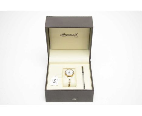 An 18ct yellow gold cased cocktail watch, fitted manual wind movement, on flexible strap stamped 9ct on silver.