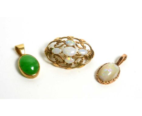 An opal brooch in 9ct gold mount; an opal pendant in 9ct gold mount; and a jade pendant, in gold mount. (3)