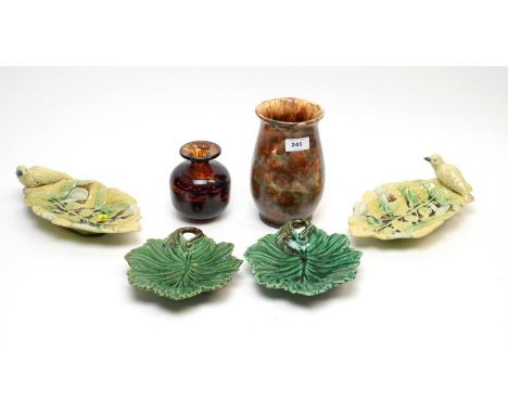 A pair of Majolica bird and leaf motif dishes, each 25cms wide; together with two Majolica green leaf motif dishes; a Crown D