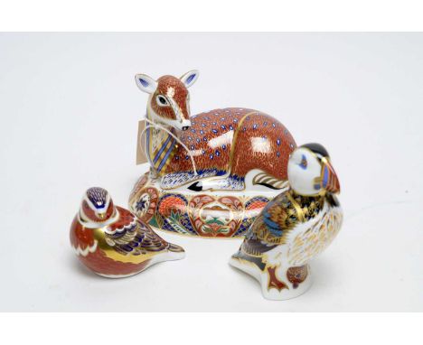 A Royal Crown Derby Collectors Guild Exclusive ceramic fawn paperweight, modelled seated, 13cms high; together with a Royal C