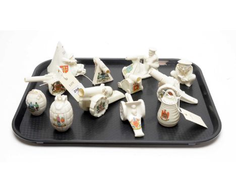 A collection of crested ceramic WWI interest and other military items, including: a model of Tommy and his Machine Gun, with 