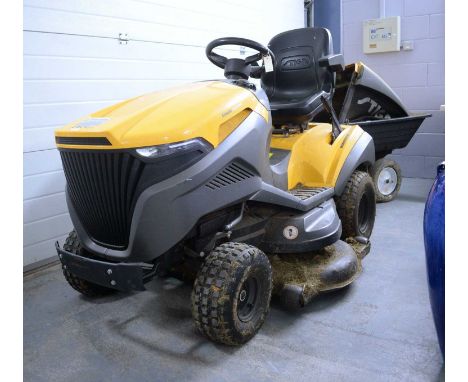 A Stiga Estate 7122 HWS ride-on lawn mower garden tractor, in yellow, with trailer and grass collector.