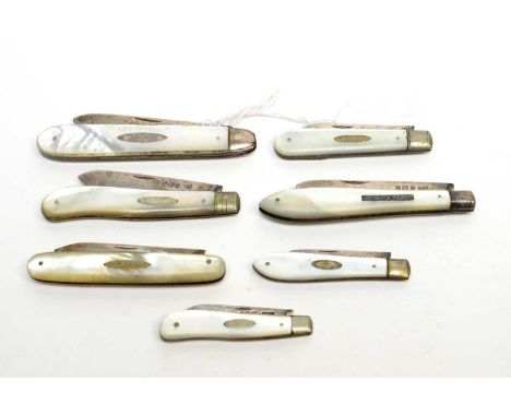 A collection of Victorian and later silver-bladed fruit knives, each with mother of pearl handle, by makers including: Edmund