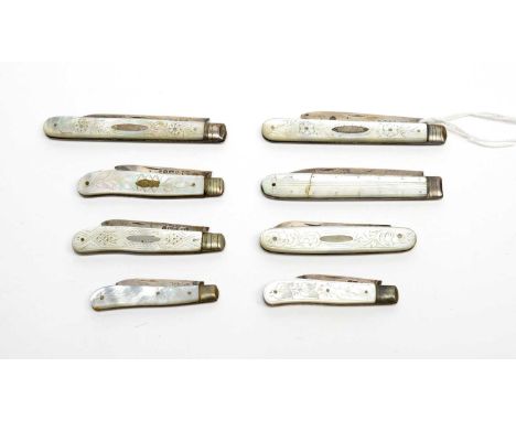 A collection of Victorian and later silver-bladed fruit knives, most with florally carved mother-of-pearl grip-scale handle, 