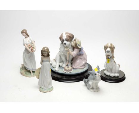 A Lladro decorative ceramic figure group of ‘A Birthday Kiss’, 06632, with base and box; together with a selection of Lladro 