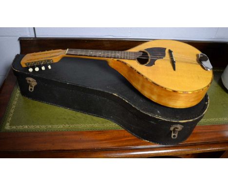 A vintage mandolin, 63cms high, in carry case.