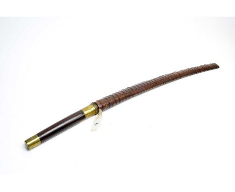 A 19th Century Asian sword, the X-blade 69cms long, on associated softwood brass bound hilt, wire bound scabbard.