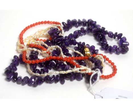 A coral and a baroque pearl necklace, with 14ct yellow gold Chinese character pattern clasp; and an amethyst pebble necklace,