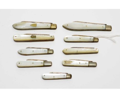 A collection of late 19th and early 20th Century silver-bladed fruit knives, each with mother-of-pearl grip-scale handle, by 