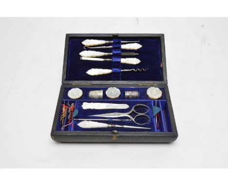 A cased sewing necessaire, with mother of pearl, steel and silver fittings.