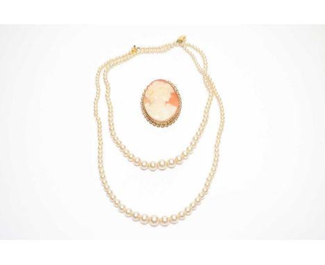 A carved shell cameo brooch, in 9ct gold mount; and a Ciro faux pearl double-row necklace, the gold clasp stamped 9ct. (2)