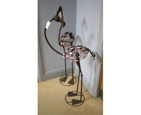A contemporary pair of cast metal flamingo sculptures, each with pink enamel cabochon feathers, 111cms high.