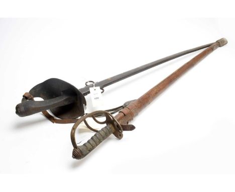 A WWI period 1912 pattern British Officer's Sword, the blade 89cms long, on hilt with full guard, with metal scabbard; togeth