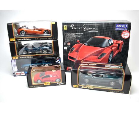 Four Maisto 1:18 Scale diecast models; a Maisto 1:24 Scale diecast model; and a Nikki Ferrari Radio Control System R/C Evolut