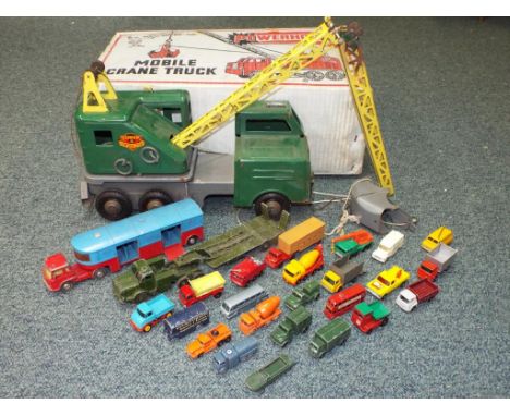 Louis Marx and Corgi plus others - Twenty five unboxed diecast motor vehicles and a Louis tinplate crane in the original box 