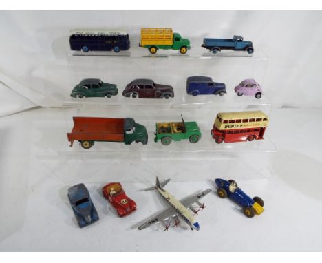 Dinky Toys - A collection of diecast model motor vehicles by Dinky to include # 283, # 24H, # 108, # 706, also included in th