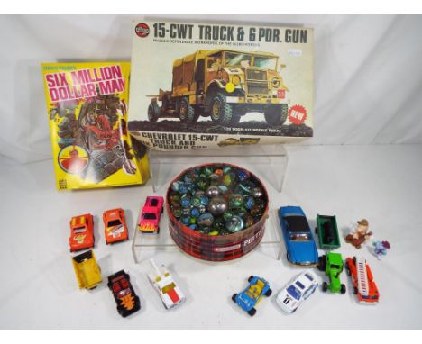 A good mixed lot to include a quantity of vintage marbles and ball bearings, a Denys Fisher Six Million Dollar Man snap toget