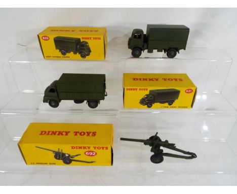 Dinky Toys - A Dinky diecast Army Converted Wagon # 623, a 3 Ton Army Wagon # 621 and a 5.5 Medium Gun # 692 (resprayed) in e