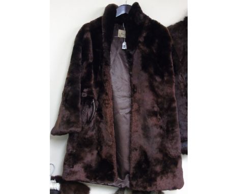 A Vintage Fur Coat with Label, 'Mocklers of Wicklow St, Dublin, Cork....'.