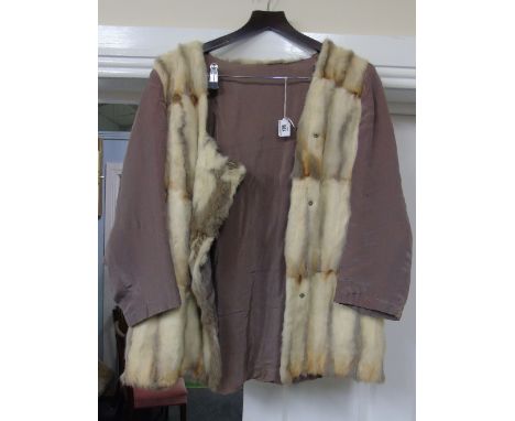 A Light Brown Fur Cape, circa 1940, along with a fur trimmed ladies jacket.